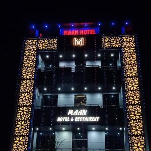 a building with a sign on the front of it at MAAN Hotel in Alwar