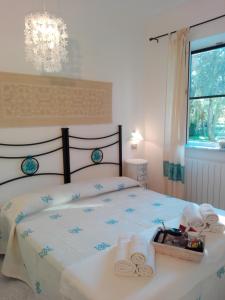 A bed or beds in a room at Anna Rita Alghero B&B