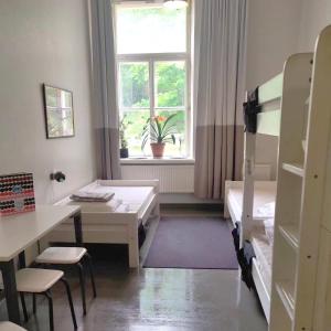 Posteľ alebo postele v izbe v ubytovaní Hostel Suomenlinna