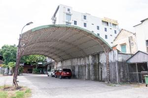 an archway over a street with cars parked at Khách Sạn Như Mai in Quang Tri