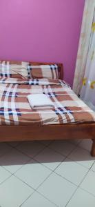 מיטה או מיטות בחדר ב-Antonio Accommodation Nakuru