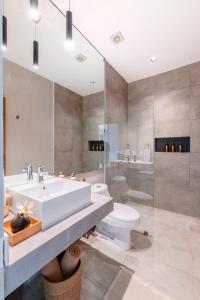 a bathroom with a sink and a toilet and a shower at Areia Boutique Hotel - Puerto Morelos in Puerto Morelos