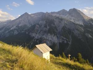 a small house on the side of a mountain at Il Fraitevino hotel bed & breakfast in Sestriere