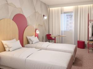 Cama ou camas em um quarto em Ibis Styles Strasbourg Centre République