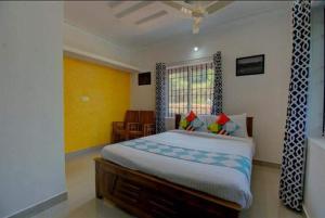 Llit o llits en una habitació de Hill view 2bhk coorg