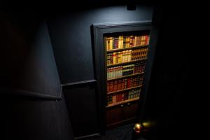 een open koelkast gevuld met veel drankjes bij The Hidden Dungeon in Brighton & Hove