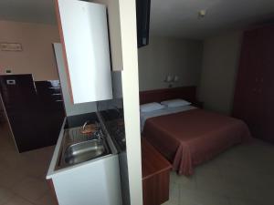 Kuchyň nebo kuchyňský kout v ubytování Standard Hotel Udine