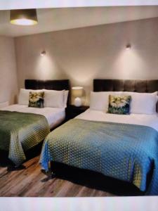 Lova arba lovos apgyvendinimo įstaigoje Luxury Guest house Claremorris