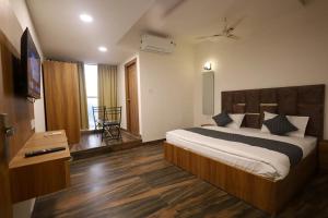 Hotel Saarthi में एक कमरे में एक या कई बेड