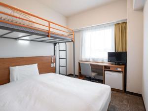 Comfort Inn Hitachinaka में एक कमरे में एक या कई बेड