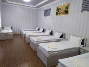 A bed or beds in a room at Zamin Hostel