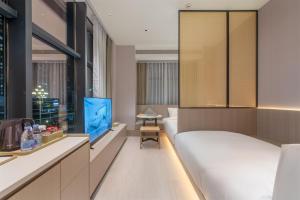 Svetainės erdvė apgyvendinimo įstaigoje ONESS Executive Hotel Guangzhou Huangpu Luogang