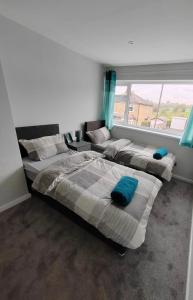 Postelja oz. postelje v sobi nastanitve Cosy Brighouse 3 bed house-Great for contractors