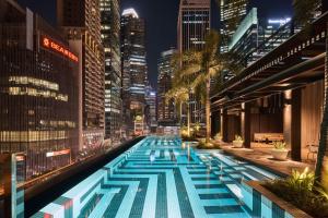 The swimming pool at or close to QT Singapore