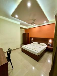 Tempat tidur dalam kamar di Hotel Citywalk Residency