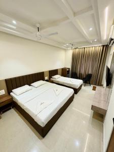 Tempat tidur dalam kamar di Hotel Citywalk Residency