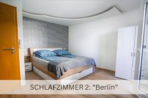 Cama ou camas em um quarto em Moderne 3-Zimmer-Wohnung im Herzen von Darmstadt - Zentrale Lage, Komfort & WLAN