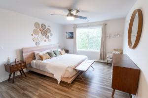 A bed or beds in a room at Comfy Family Home, Walkable Neighborhood + Patio!