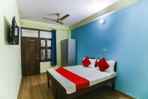 Hotel O The Grand Avenue Hotel में एक कमरे में एक या कई बेड