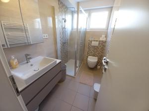 Vannituba majutusasutuses Apartman Lavio