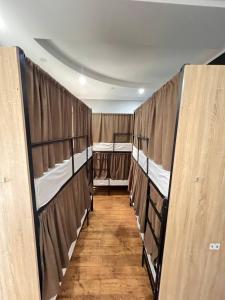 a hallway with three bunk beds in a room at Like Hostel in Chişinău