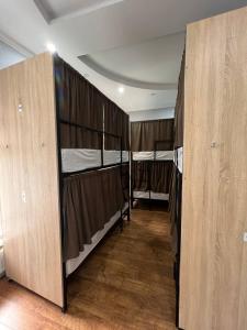 a room with two bunk beds in a room with at Like Hostel in Chişinău