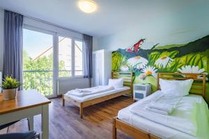 StayInn Hostel und Gästehaus tesisinde bir odada yatak veya yataklar