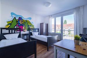 StayInn Hostel und Gästehaus tesisinde bir odada yatak veya yataklar