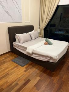 Кровать или кровати в номере RoseWood Suites At Reizz Residence