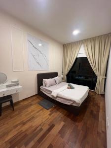 Кровать или кровати в номере RoseWood Suites At Reizz Residence