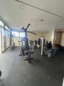 a gym with treadmills and cardio equipment in a building at Flat Luxuoso Biena Sena Madureira Vila Mariana com garagem 1009 in Sao Paulo