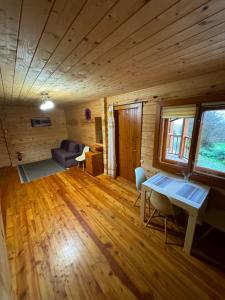 a living room with a table and a couch at Arnika in Skhidnitsa