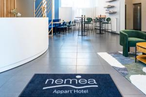 Nemea Appart Hotel Elypseo Strasbourg Port tesisinde bir oturma alanı