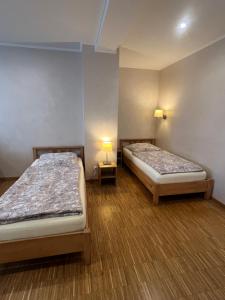 Posteľ alebo postele v izbe v ubytovaní City Home- Business Apartment, private Parking Free