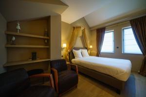 Voodi või voodid majutusasutuse Hotel Saint-Amour toas