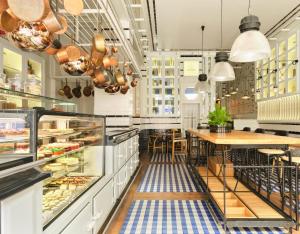 a bakery with a table in the middle at Only YOU Boutique Hotel Madrid in Madrid