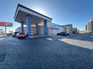 a gas station with cars parked in a parking lot at Studio 6 Suites Amarillo, TX West Medical Center in Amarillo