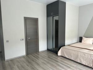 Giường trong phòng chung tại Prestige Apartments Kamianske