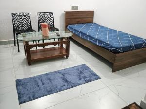 A bed or beds in a room at Vigneshwara Nilaya