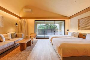 A bed or beds in a room at VILLA COMMUNICO,Nara