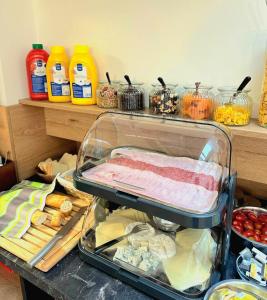 a drawer filled with meat and other food items at Hotel Karlova Prague in Prague