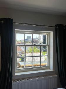 a window in a room with a view at Lento Apartment in Winchester