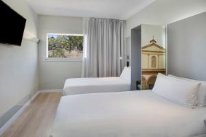 Gulta vai gultas numurā naktsmītnē B&B HOTEL Figueres