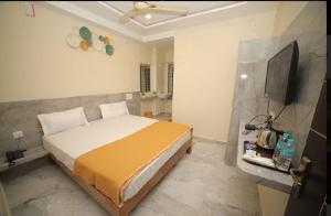 Cama ou camas em um quarto em Sri Ganesh Residency