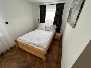 Vuode tai vuoteita majoituspaikassa Apartamenty u Mocarnego