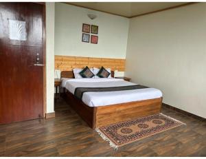 Cama ou camas em um quarto em The Hill Castle, Gangtok