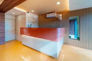 a kitchen with a counter in the middle of a room at Treebo Green Village Resort - Goa in Maneri