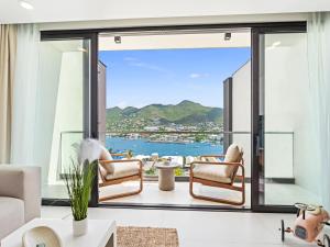 a living room with a view of the ocean at The Hills Residence in Simpson Bay