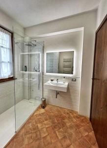 a bathroom with a sink and a shower at CasalPiano in Orvieto