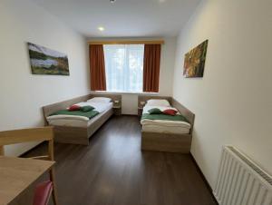 Cama ou camas em um quarto em WinBudget "bed&breakfast" Guntramsdorf